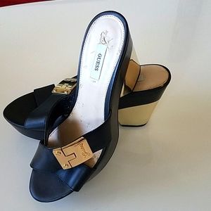 A pair of Guess shoes